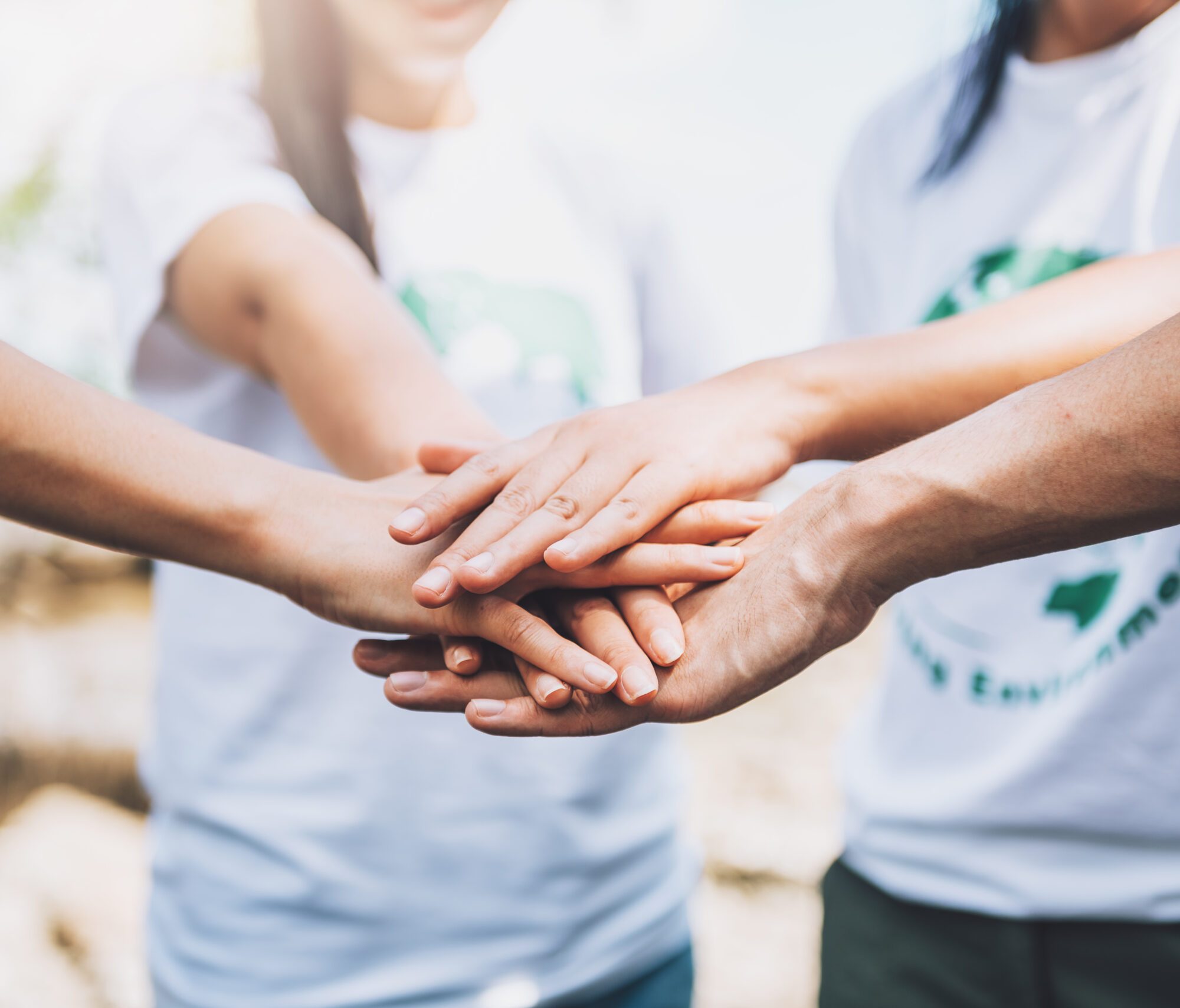 close-up-people-volunteer-teamwork-putting-finger-star-shapehands-togetherstack-handsunity-teamwork-world-environment-day close-up-people-volunteer-teamwork-putting-finger-star-shapehands-togetherstack-handsunity-teamwork-world-environment-day